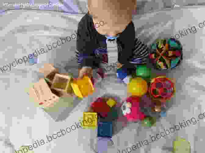 A Baby Exploring Various Toys With Different Textures And Shapes Touch In Early Development