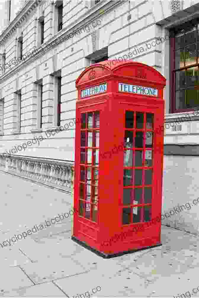 A Classic Red Telephone Box Standing On A London Street, With A Person Using It To Make A Call. London Souvenirs Alec Rowell