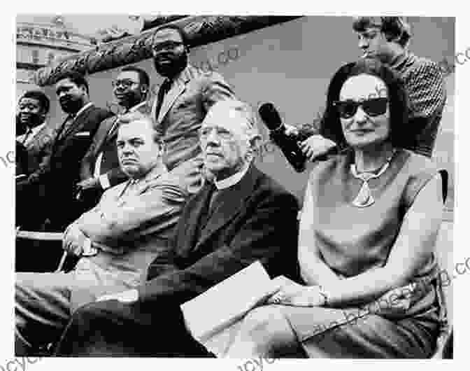 Ruth First And Joe Slovo, Two Prominent Anti Apartheid Activists, Pose For A Photo Together. Ruth Is Smiling And Looking Directly At The Camera, While Joe Is Looking Slightly To The Side With A Determined Expression. The Photo Is Taken In Black And White And Has A Grainy Texture, Suggesting That It Was Taken During The 1960s Or 1970s. Ruth First And Joe Slovo In The War Against Apartheid
